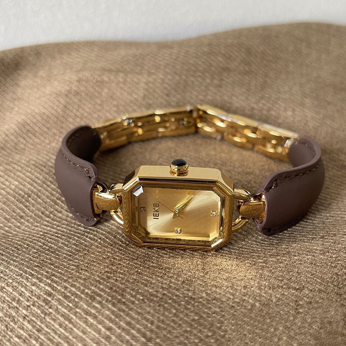 A vintage watch that blends leather texture with golden accents, exuding an elegant aura